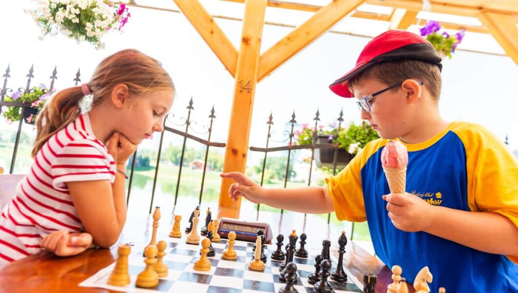 two kids playing chess