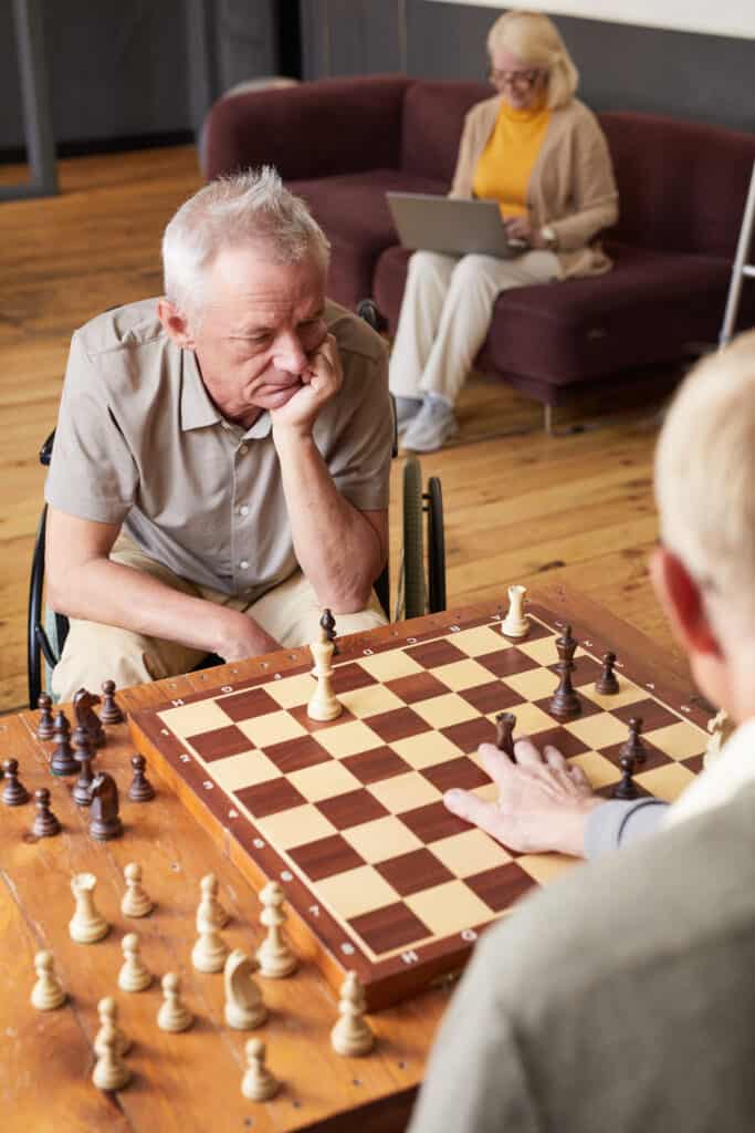 two senior men playing chess